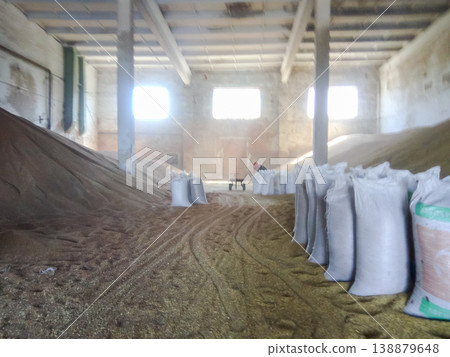 Heap of grains of barley and wheat in stock Heap of grains of barley and wheat in stock 138879648
