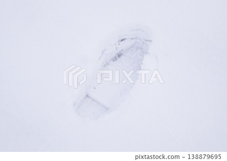 Human footprints in the snow. The path in the snow Human footprints in the snow. The path in the snow 138879695