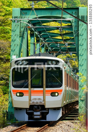 A 315 series train crossing the First Sakawa River Bridge. 138880293