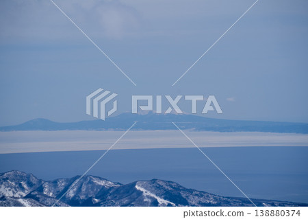 Drifting ice floes and a distant island visible across the sea. A breathtaking view that represents the magnificent nature of Hokkaido. Landscape photography capturing the majestic natural beauty of Hokkaido. Drifting ice floes and a distant island visible across the sea. A breathtaking view that represents the magnificent nature of Hokkaido. Landscape photography capturing the majestic natural beauty of Hokkaido. 138880374