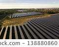 Aerial view of large solar farm with panel rows 138880860