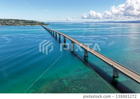 Aerial view of Kouri Bridge and the emerald green sea in Okinawa. 138881272