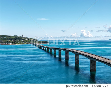 Aerial view of Kouri Bridge and the emerald green sea in Okinawa. Aerial view of Kouri Bridge and the emerald green sea in Okinawa. 138881274