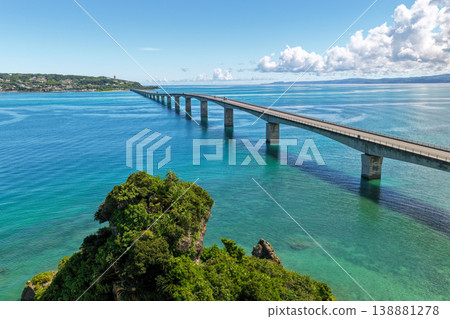 Aerial view of Kouri Bridge and the emerald green sea in Okinawa. Aerial view of Kouri Bridge and the emerald green sea in Okinawa. 138881278