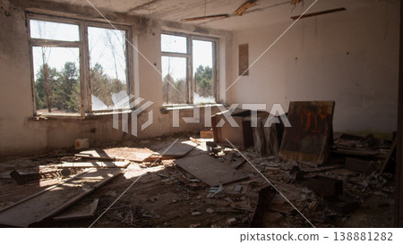 Sunlit Decaying Room With Broken Windows, Scattered Debris, Peeling Paint, Abandoned Furniture, Floorboards Sunlit Decaying Room With Broken Windows, Scattered Debris, Peeling Paint, Abandoned Furniture, Floorboards 138881282
