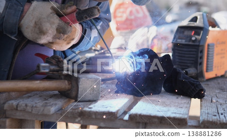 Heavy Construction Scene. Welding Beam With Bright Arc. Intensive Welding Operation On Structural Framework. Fabrication Of Steel Beam Under Intense Arc Welding Illumination On Site 138881286
