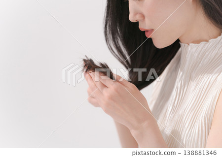 Woman suffering from hair Woman suffering from hair 138881346