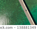 An aerial view of Kouri Bridge in Okinawa, seen from directly above, against the backdrop of the emerald green sea. 138881349