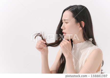 Woman suffering from hair Woman suffering from hair 138881397