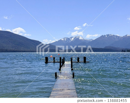 Wooden pier on Lake Te Anau with views of snow-capped mountains Wooden pier on Lake Te Anau with views of snow-capped mountains 138881455
