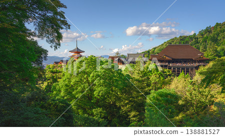 Kyoto, Japan - Oct 11 2024, panoramic view through foliage of Kiyomizu-Dera temple complex with a pagoda, without people, with a clear blue sky and a forest in foreground, at daytime, Kyoto, Japan Kyoto, Japan - Oct 11 2024, panoramic view through foliage of Kiyomizu-Dera temple complex with a pagoda, without people, with a clear blue sky and a forest in foreground, at daytime, Kyoto, Japan 138881527