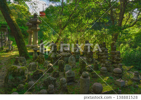 Kyoto, Japan - Oct 11 2024, panoramic view of cemetery with many moss-covered tombstones in form of stone pyramids or sculptures surrounded by trees on territory of Kiyomizu-dera Temple, Kyoto, Japan Kyoto, Japan - Oct 11 2024, panoramic view of cemetery with many moss-covered tombstones in form of stone pyramids or sculptures surrounded by trees on territory of Kiyomizu-dera Temple, Kyoto, Japan 138881528