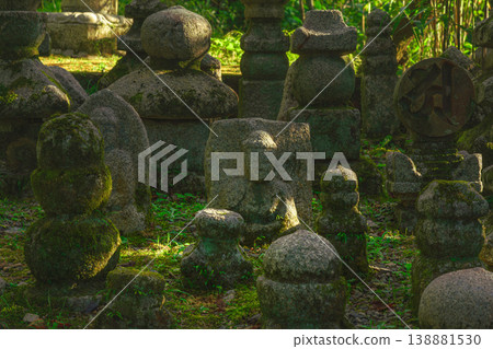 Kyoto, Japan - Oct 11 2024, panoramic view of cemetery with many moss-covered tombstones in form of stone pyramids or sculptures surrounded by trees on territory of Kiyomizu-dera Temple, Kyoto, Japan Kyoto, Japan - Oct 11 2024, panoramic view of cemetery with many moss-covered tombstones in form of stone pyramids or sculptures surrounded by trees on territory of Kiyomizu-dera Temple, Kyoto, Japan 138881530