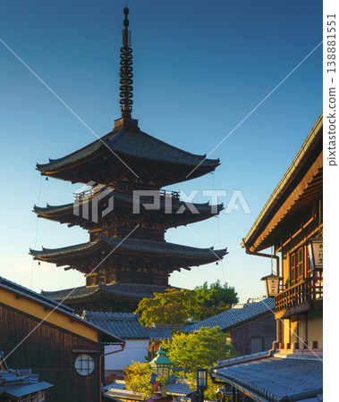 Kyoto, Japan - Oct 11 2024, vertical view of Yasaka Pagoda of Hokan-ji Temple, building facades and trees in the foreground, in the evening, Kyoto, Japan Kyoto, Japan - Oct 11 2024, vertical view of Yasaka Pagoda of Hokan-ji Temple, building facades and trees in the foreground, in the evening, Kyoto, Japan 138881551