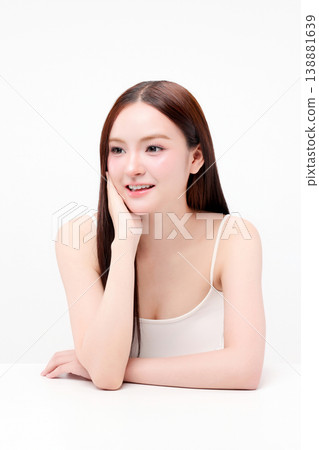 Portrait beautiful young Asian woman with K beauty style makeup and perfect skin on isolated white background. Facial and skin care concept for commercial advertising. Portrait beautiful young Asian woman with K beauty style makeup and perfect skin on isolated white background. Facial and skin care concept for commercial advertising. 138881639