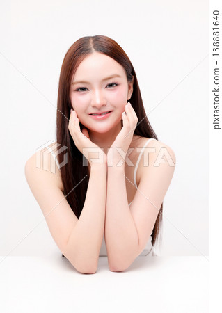 Portrait beautiful young Asian woman with K beauty style makeup and perfect skin on isolated white background. Facial and skin care concept for commercial advertising. Portrait beautiful young Asian woman with K beauty style makeup and perfect skin on isolated white background. Facial and skin care concept for commercial advertising. 138881640