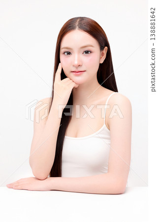 Portrait beautiful young Asian woman with K beauty style makeup and perfect skin on isolated white background. Facial and skin care concept for commercial advertising. Portrait beautiful young Asian woman with K beauty style makeup and perfect skin on isolated white background. Facial and skin care concept for commercial advertising. 138881642