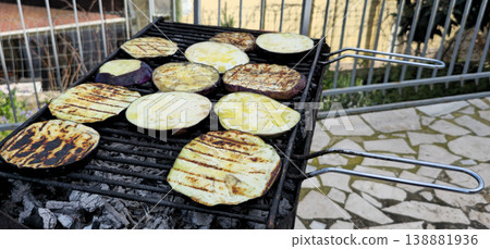Close up view of Roasted eggplants on carbon barbecue 138881936