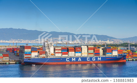 Osaka, Japan - Oct 11 2024, panoramic sea view of the docks of the Osaka Commercial Port with a heavily loaded CMA CGM cargo ship moored during the daytime, Osaka, Japan Osaka, Japan - Oct 11 2024, panoramic sea view of the docks of the Osaka Commercial Port with a heavily loaded CMA CGM cargo ship moored during the daytime, Osaka, Japan 138881983