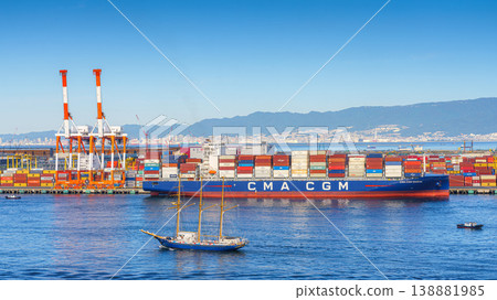 Osaka, Japan - Oct 11 2024, panoramic sea view of the docks of the Osaka Commercial Port with a heavily loaded CMA CGM cargo ship moored during the daytime, Osaka, Japan Osaka, Japan - Oct 11 2024, panoramic sea view of the docks of the Osaka Commercial Port with a heavily loaded CMA CGM cargo ship moored during the daytime, Osaka, Japan 138881985