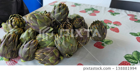 Close up view of Artichokes set up on table to be cooked Close up view of Artichokes set up on table to be cooked 138881994