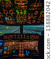 A captivating point-of-view shot from inside an airplane cockpit. The flight deck instruments glow as the plane navigates a snowy runway at night.High quality photo 138882042