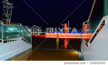 Muroran, Hokkaido, Japan - Oct 04 2024, panoramic view of pool decorated with a sculpture of a plump woman in a swimsuit, on upper deck of the MSC Bellissima cruise ship, at night, Muroran, Japan Muroran, Hokkaido, Japan - Oct 04 2024, panoramic view of pool decorated with a sculpture of a plump woman in a swimsuit, on upper deck of the MSC Bellissima cruise ship, at night, Muroran, Japan 138882095