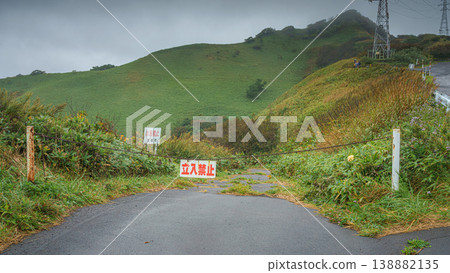 Muroran, Hokkaido, Japan - Oct 4 2024, panoramic view of a country paved road passing through forests and fields, without cars and without people, in cloudy weather, at daytime, Muroran, Japan 138882135