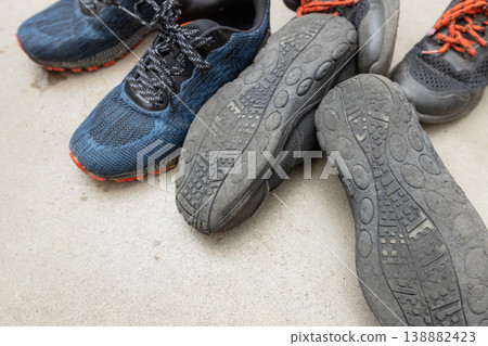Worn-out black shoes; the soles are worn down; no consideration for safety. Worn-out black shoes; the soles are worn down; no consideration for safety. 138882423