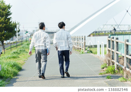 Workers surveying the riverbed 138882546