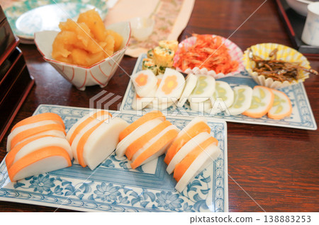 Red and white kamaboko and colorful osechi to enjoy during the New Year Red and white kamaboko and colorful osechi to enjoy during the New Year 138883253