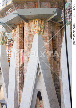 A close-up of the exquisite details of the column decorations on the exterior of the Sagrada Familia. A close-up of the exquisite details of the column decorations on the exterior of the Sagrada Familia. 138883272