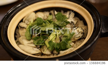 Oyster rice cooked in an earthenware pot Oyster rice cooked in an earthenware pot 138884196