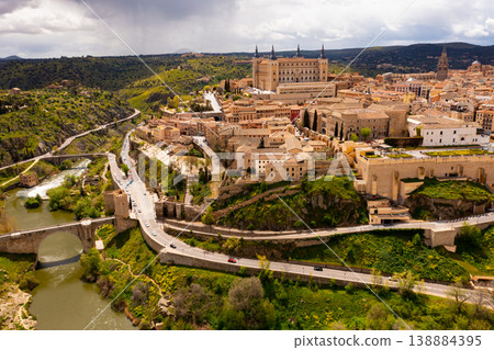 Drone view of Toledo on Tagus river with medieval Alcazar fortress Drone view of Toledo on Tagus river with medieval Alcazar fortress 138884395
