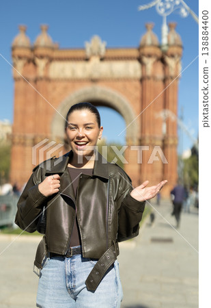 Portrait of girl in front of the Arc de Triomphe on sunny spring day. Barcelona, ​​Spain 138884400