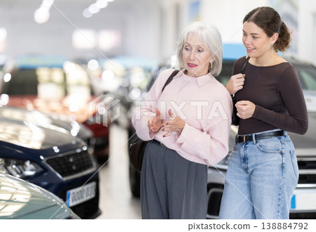 Young woman buys a new car for her elderly mother Young woman buys a new car for her elderly mother 138884792