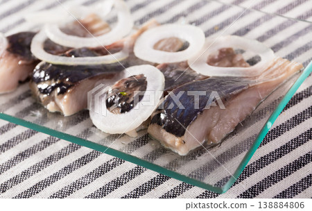 Marinated herring with sliced onion 138884806