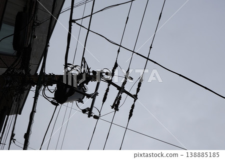 A quiet afternoon in a cloudy townscape with towering utility poles (4) A quiet afternoon in a cloudy townscape with towering utility poles (4) 138885185