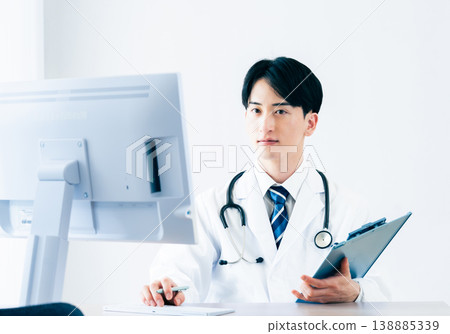 A young doctor at a computer 138885339