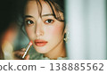 A close-up of a woman's face, finished with elegant lipstick. 138885562