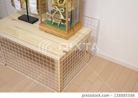 A handmade baby guard made from wire mesh purchased at a 100-yen store to surround the Boys' Festival dolls. A handmade baby guard made from wire mesh purchased at a 100-yen store to surround the Boys' Festival dolls. 138885586