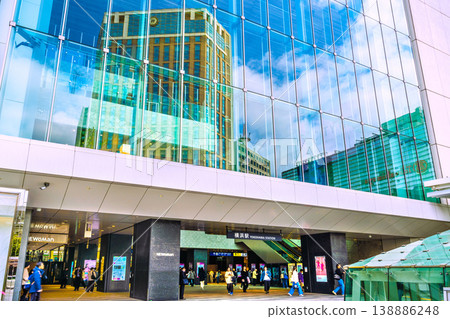 A view of Yokohama, Japan, on April 9th. The view includes Yokohama Station and the Yokohama Bay Sheraton Hotel & Towers reflected in the window glass. A view of Yokohama, Japan, on April 9th. The view includes Yokohama Station and the Yokohama Bay Sheraton Hotel & Towers reflected in the window glass. 138886248