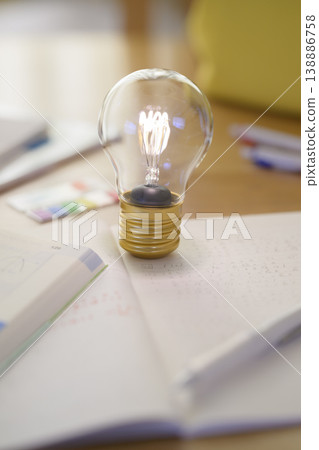 Study tools and light bulbs of inspiration Study tools and light bulbs of inspiration 138886758