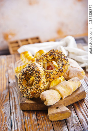 close-up of round rich light buns with seeds freshly prepared bakery white bread carbohydrate diet sprinkled with white and black sesame seeds close-up of round rich light buns with seeds freshly prepared bakery white bread carbohydrate diet sprinkled with white and black sesame seeds 138886873