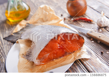 Pieces of fresh salmon on a table 138886875