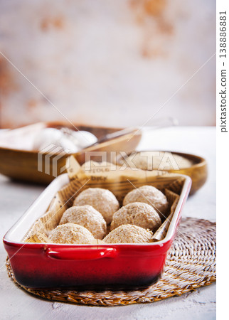 Rounded bread dough balls prepared for baking Rounded bread dough balls prepared for baking 138886881