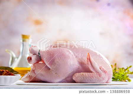 Fresh raw chicken with spices on grey textured table 138886938