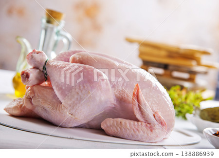 Fresh raw chicken with spices on grey textured table 138886939