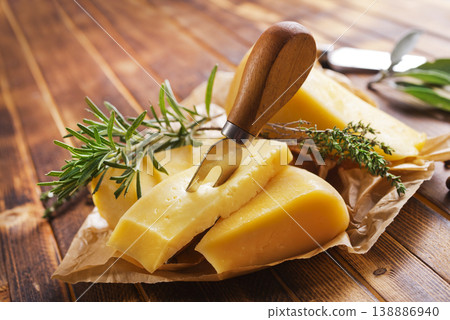 Plate with pieces of cheese and spice and rosemary Plate with pieces of cheese and spice and rosemary 138886940