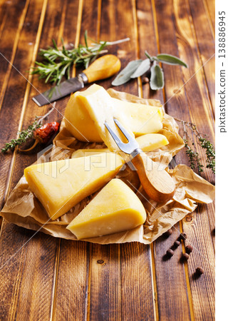 Plate with pieces of cheese and spice and rosemary Plate with pieces of cheese and spice and rosemary 138886945
